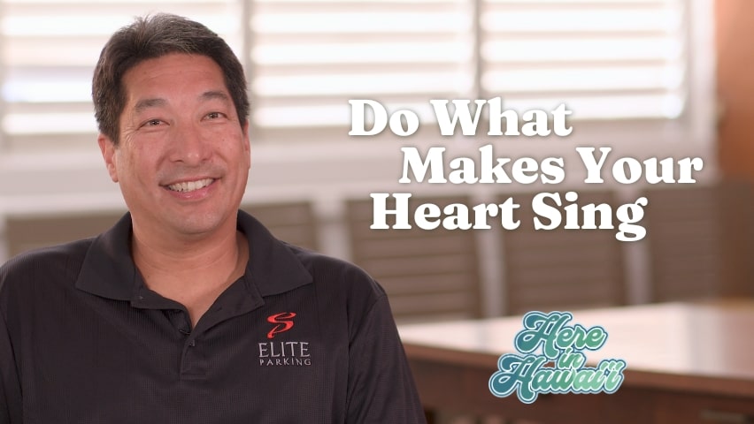 Man smiling with text "Do what makes your heart sing"