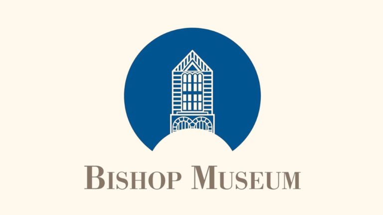 Bishop Museum logo: a blue circle frames a stylized historic building façade, with “Bishop Museum” in gray serif lettering below.